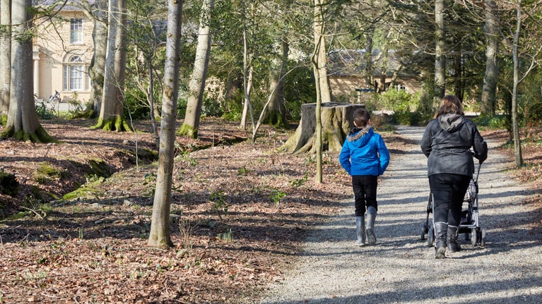 Visitors enjoying a walk at Llanerchaeron, Wales